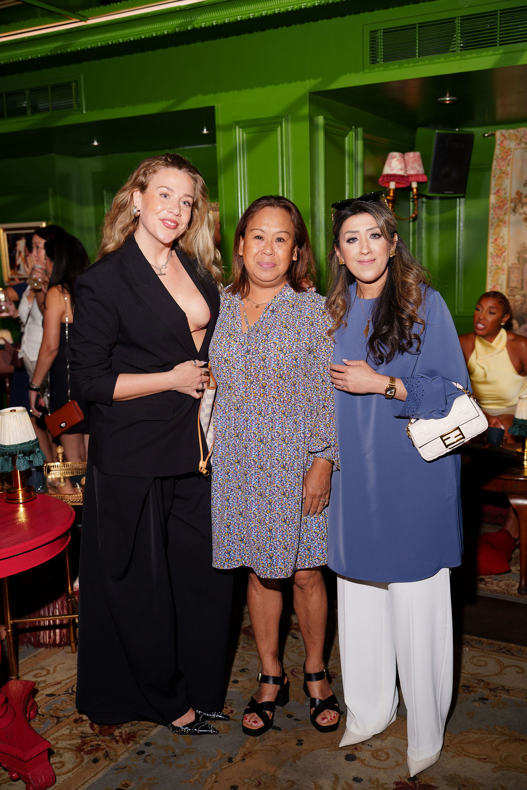 Three women from different generations standing together at a theCOLLECTIVE gathering
