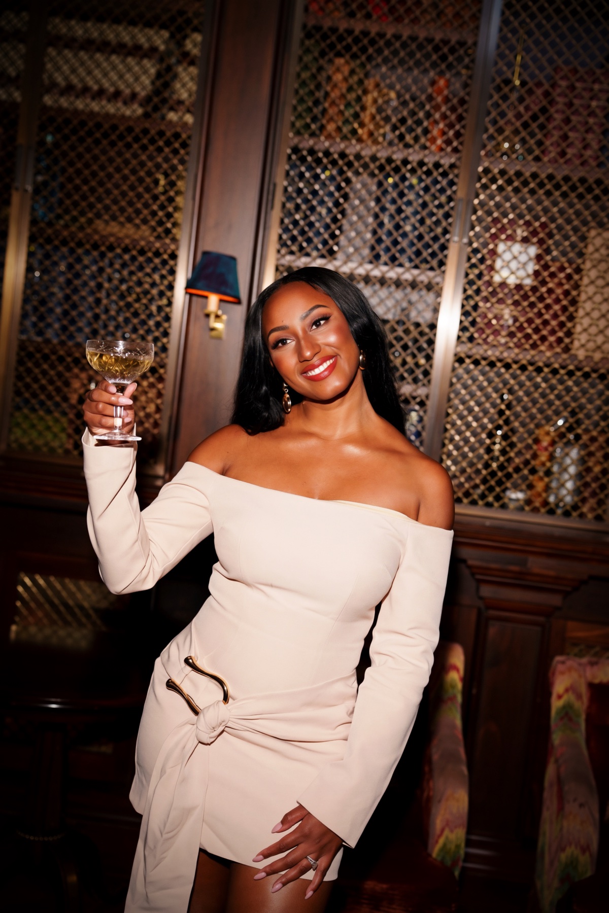 theCOLLECTIVE founder Mel Labiran raising a glass at a gathering